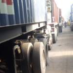 A lineup of trucks queuing to enter the port