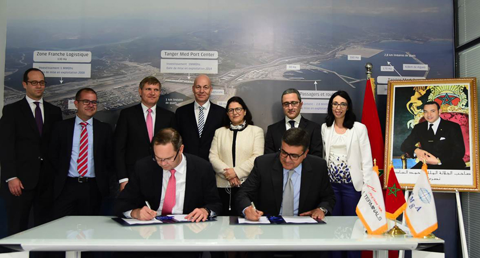 CEO of APM Terminals, Kim Fejfer (seated left) and Chairman of Tanger Med Special Agency, Fouad Brini (seated right) signing an agreement for development of a new container transshipment terminal at the Tanger Med 2 port complex in Morocco. 