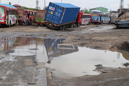 Deadly potholes at Ilasamaja section of the Apapa-Oshodi expressway; the major artery connecting the nation's two major seaports – Lagos Port Complex Apapa and Tin Can Island Port Complex – and the Murtala Muhammed International Airport, Lagos.