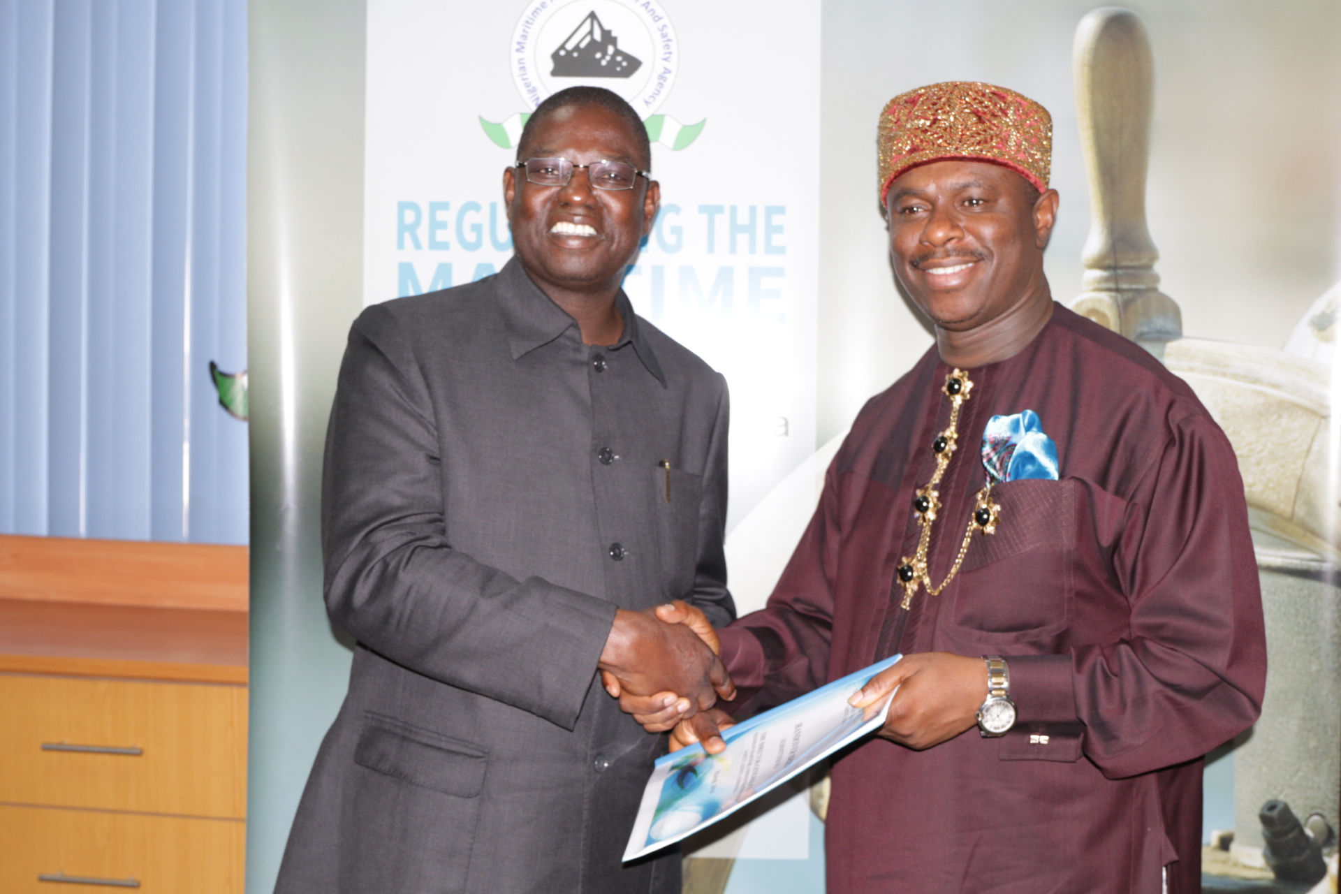 Dr. Dakuku Peterside (right) taking over the reigns of office from Haruna Jauro as Director-General of Nigerian Maritime Administration and Safety Agency (NIMASA) in Lagos on Wednesday.