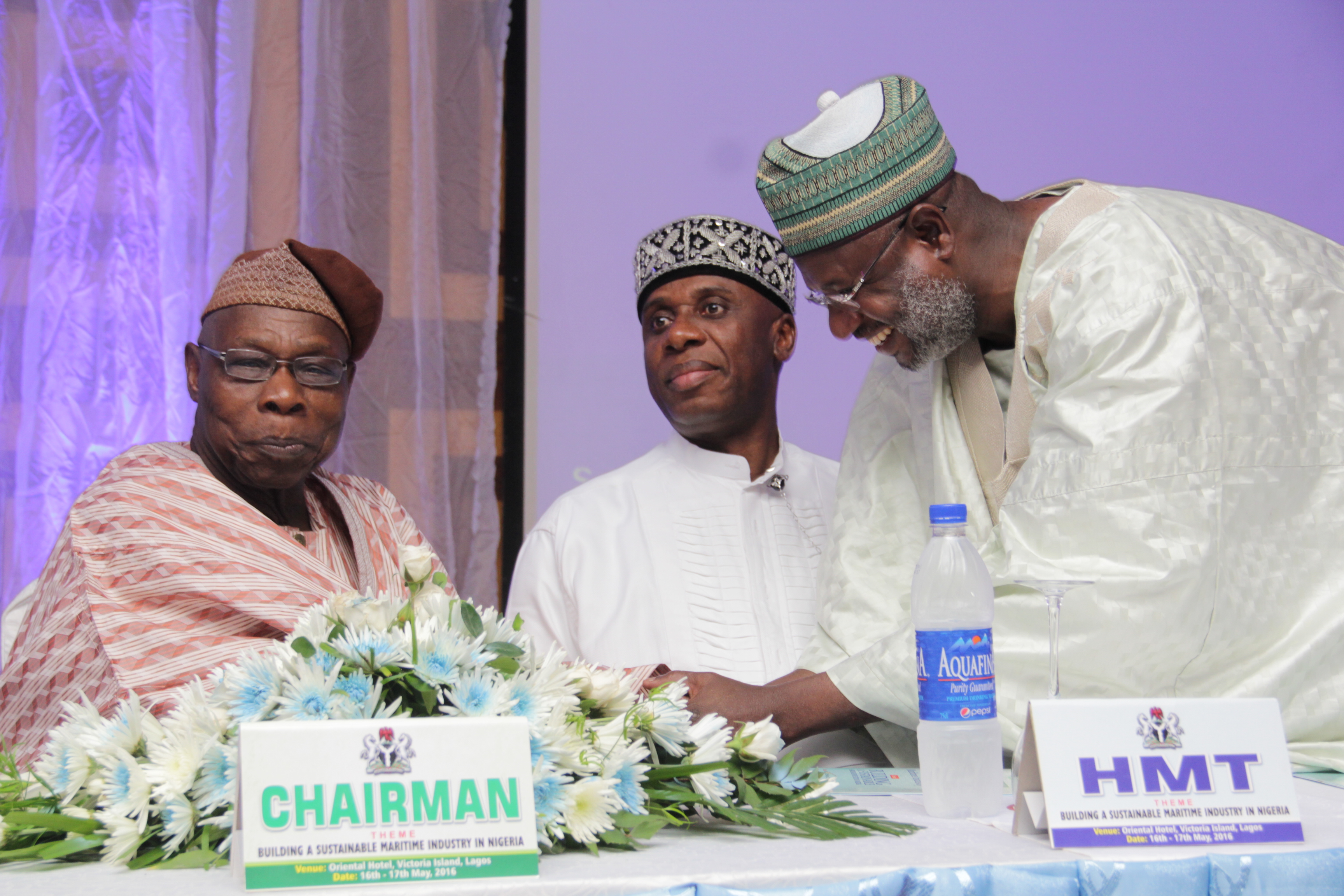 Chairman, SenateCommittee on Marine Transport, Senator Rufai Ahmed Sanni exchanges pleasantries with former President Olusegun Obasanjo while Minister of Transportation, Rotimi Amaechi watches at the maritime stakeholders conference organised by the Federal Ministry of Transportation in Lagos on Monday last week. See pages 6 and 7 for more photographs. 