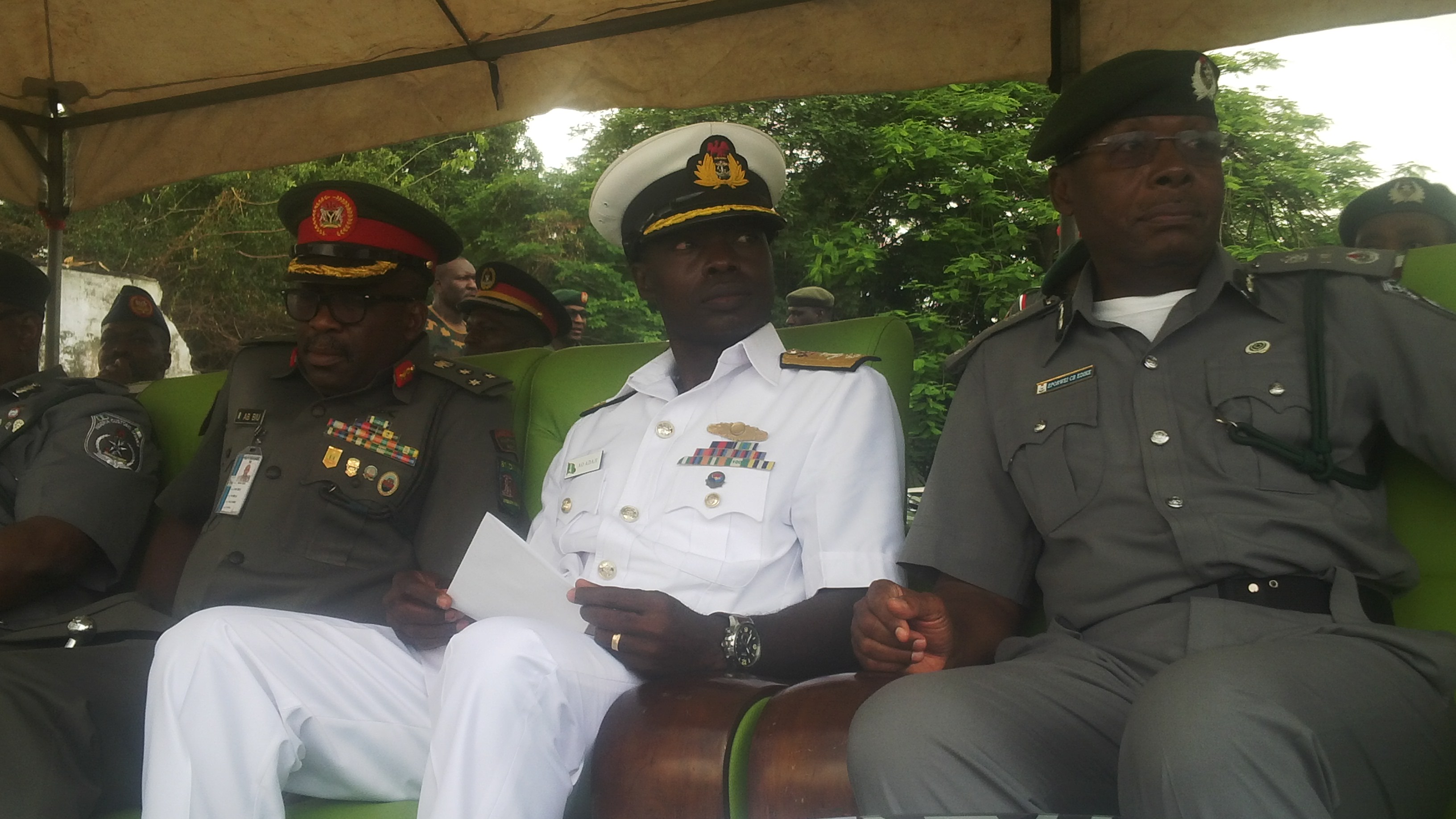 L-R Commander, 9 Brigade of the Nigerian Army, Brigadier General Bulama Biu; Commanding Officer, Nigerian Navy Ship (NNS) Beecroft, Abraham Adaji and Zonal Coordinator, Zone A of the Nigeria Customs Service, Assistant Comptroller General Charles Edike at the passing out ceremony of officers of the Enforcement Unit of Kirikiri Lighter Terminal (KLT) command trained on weapon handling by the Nigerian Army at Ikeja, Lagos on Friday.  