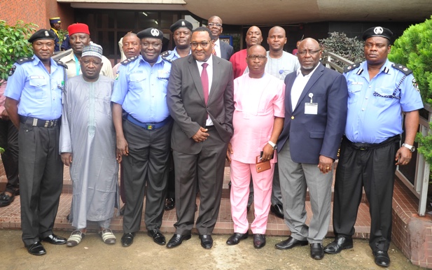 Executive Secretary/CEO of Nigerian Shippers' Council (NSC), Hassan Bello (middle), Assistant Inspector General of Police (AIG) in charge of Maritime Command, Muhammed Kastina (third left) and others in a group photograph when the AIG visited NSC recently.  