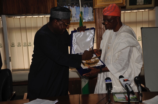 Executive Secretary, Nigerian Shippers' Council, Hassan Bello (left) presenting gift to the Executive Secretary, National Universities Commission, Professor Julius Okojie when the council officials visited NUC in Abuja recently. 