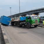 PHOTOS: Container truck loaded with liquid sugar falls on Iganmu Bridge in Lagos