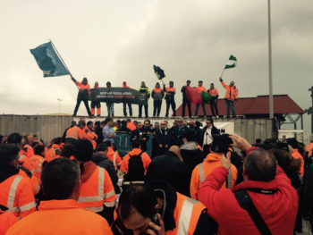 Spain approves port reform, dockworkers protest