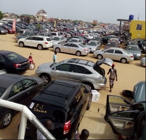 Benin's port city of Cotonou, thousands of used cars fill 1