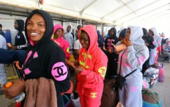 migrants from the Nigeria wait at Tripoli’s Mitiga International Airport