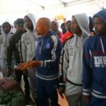 migrants from the Nigeria wait at Tripoli’s Mitiga International Airport
