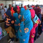 migrants from the Nigeria wait at Tripoli’s Mitiga International Airport