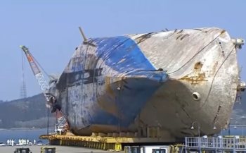 Sewol transferred to land, search for remains to start