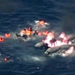 migrants rescued from burning rubber dinghy off Spain