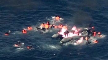 migrants rescued from burning rubber dinghy off Spain