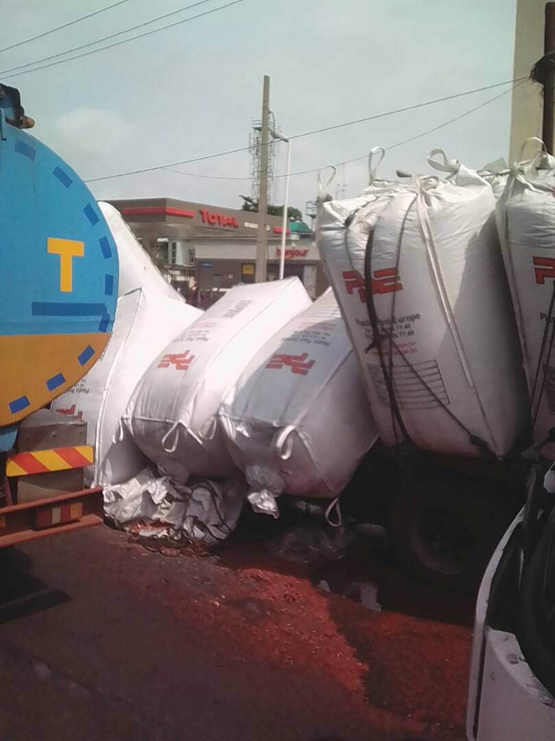 Another truck pours its load due to bad road at Apapa