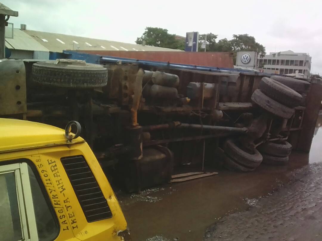 Trucks laden with goods fall at Apapa road