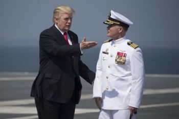 Trump, aboard new aircraft carrier, wants boost for military funds