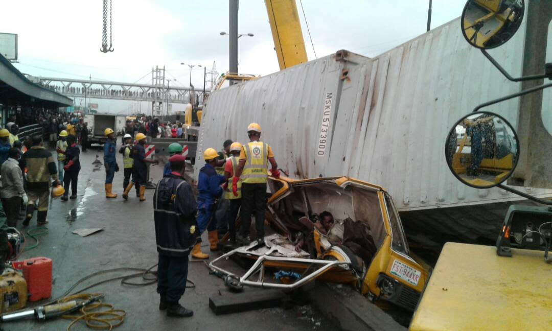 container falls on commercial bus at Ojota