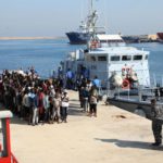 Migrants line up upon their arrive at a naval base after they were rescued by Libyan coastguard, in Tripoli