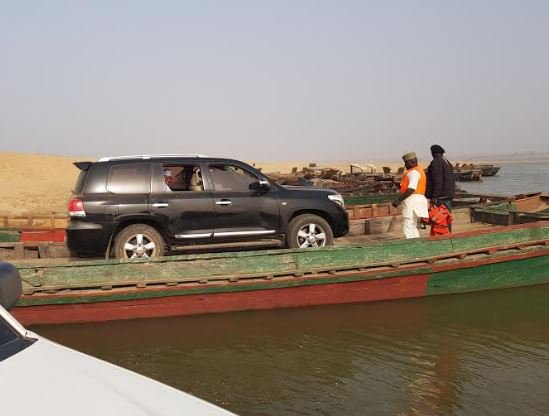 PHOTOS: Sokoto Governor, Tambuwal in dangerous trip across River Benue