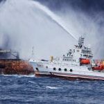 China says sunken Iranian tanker may now be leaking heavy oil