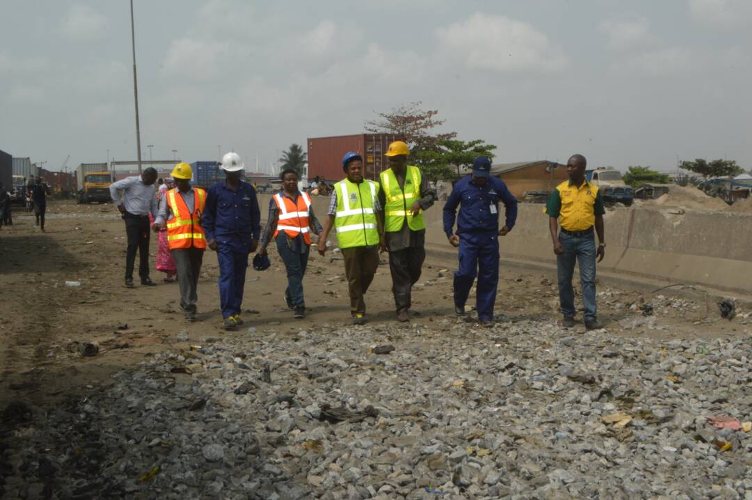 Officials of the Tin Can Island Port Complex taking a long walk on the dilapidated stretch of the road.