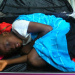 Father of boy smuggled into Spain in suitcase on trial