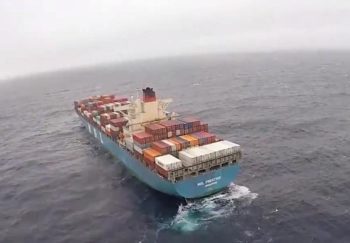 Disabled containership MOL Prestige under tow off British Columbia