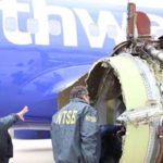 U.S. inspectors investigate mid-air jet engine explosion
