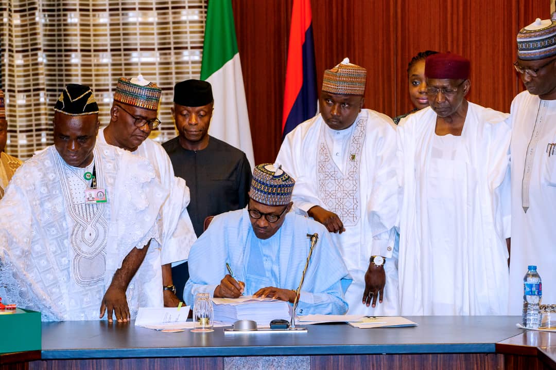Buhari signs 2018 budget, concerned by changes