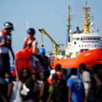 Spain opens port to ship carrying migrants