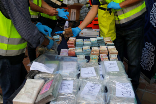 Police display a portion of the six tonnes of cocaine, money and other material which was seized during a drug bust at an industrial estate at the police headquarters in Malaga, Spain, October 25, 2018.  REUTERS/Jon Nazca