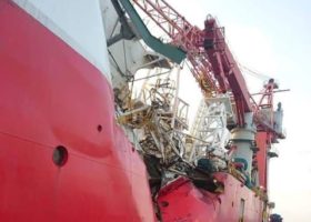 Cable ship capsizes near Singapore after tanker collision