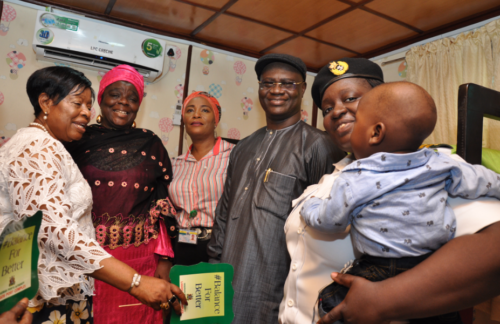 L-R: Alaba Lawson; Ali-Ibrahim, Shabi; Adeyanju; the first baby to use the crèche and his mother. 