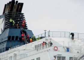 Migrants scramble aboard Calais ferry, sparking police sweep