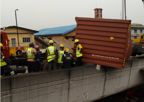 PHOTOS: Commuters stranded as another container falls on Ojuelegba bridge 
