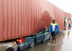 PHOTOS: Container crushes two cars at Tin Can