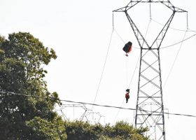 Pilot trapped on high-voltage power line after ejecting from aircraft 