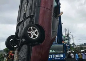 Woman dies as car plunges into river