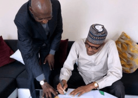 Buhari signs oil contract amendment law in London 