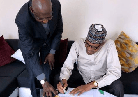 Buhari signs oil contract amendment law in London 