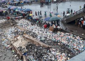 Heaps of refuse swamp Tin Can port