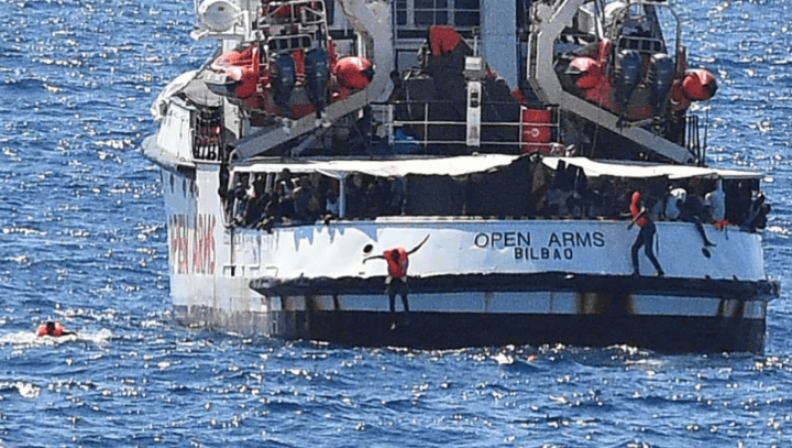 70 migrants jump overboard from charity boat 