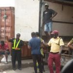 PHOTOS: Tiles worth millions of naira damaged as container falls off truck in Apapa 