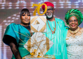 The celebrant, Chief Christopher Abiodun Borha with his wife and daughter.